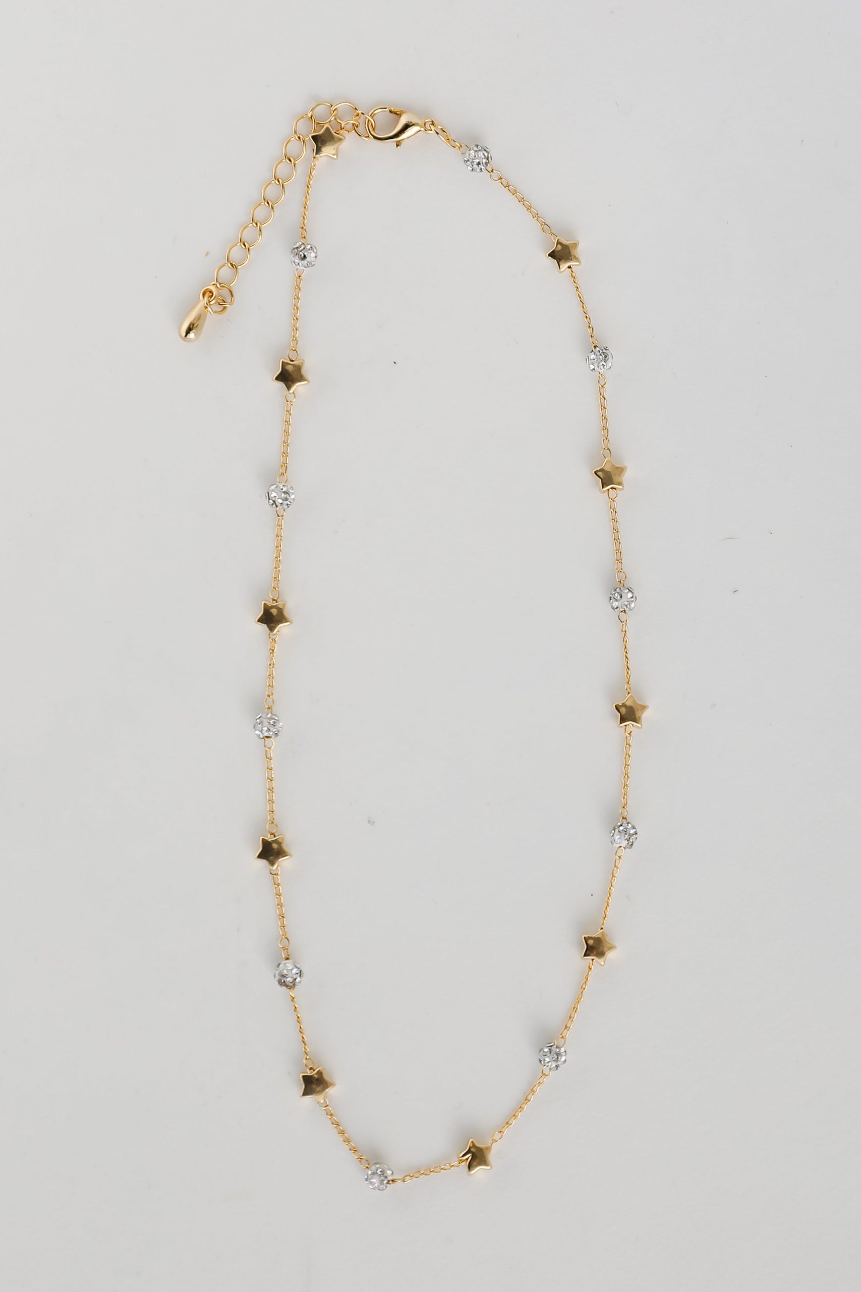 shopdressup_gold_star_necklace-3_2c122c5b-d86a-44a5-9b95-1a1134520855.jpg